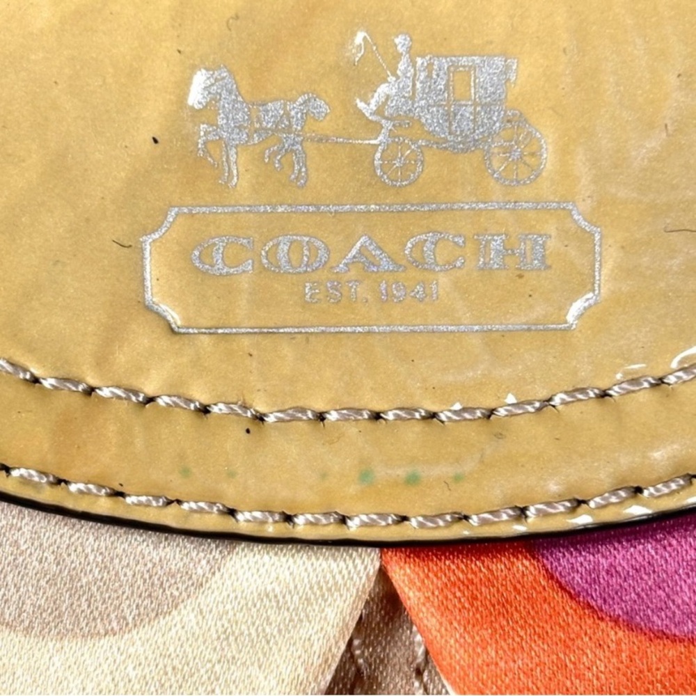 Coach Optic C Colorful Patterned Wristlet
Orange pink cream. Patent Leather - Picture 5 of 11